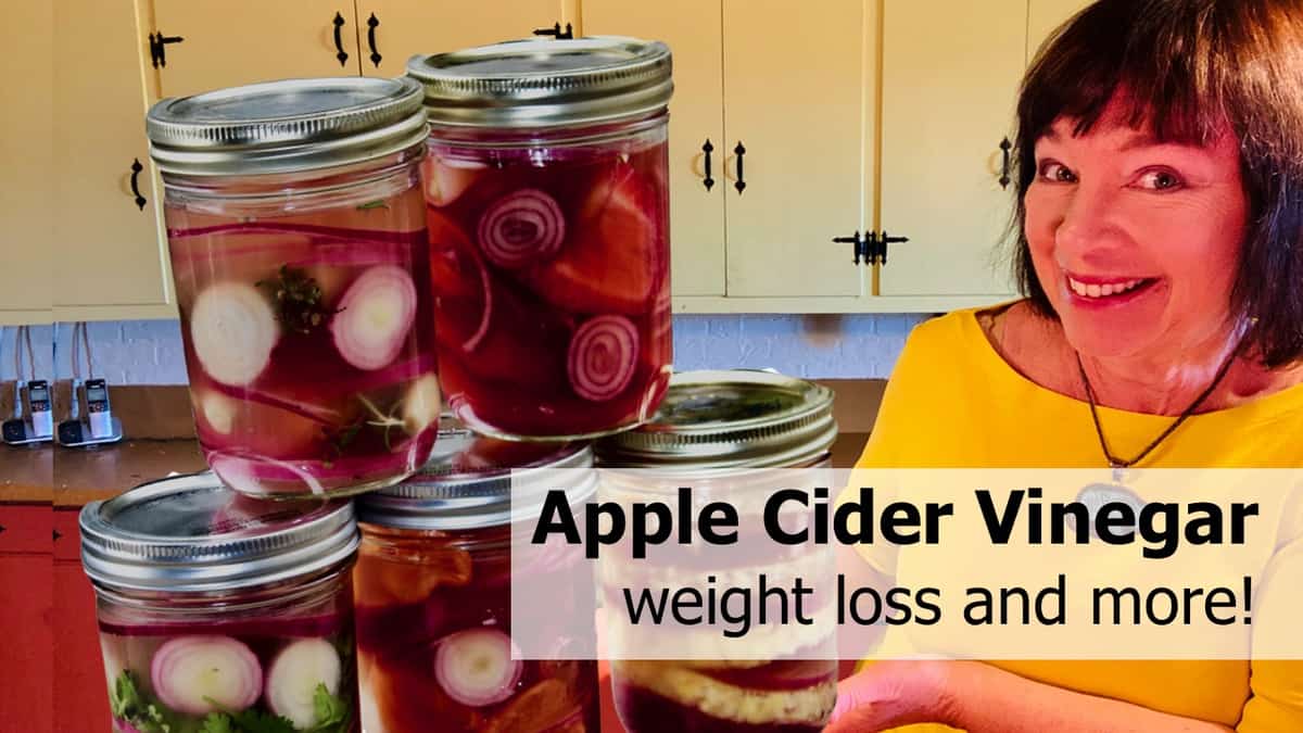 Amanda Rose with jars of onions pickled in apple cider vinegar