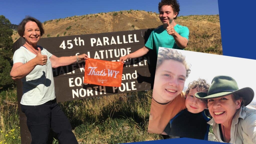 Amanda and sons at the 45th parallel sign in Yellowstone National Park