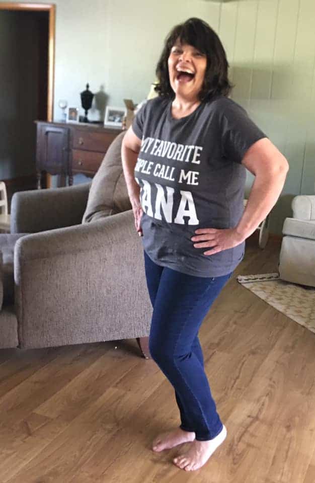 Shon stands laughing and happy in her weight loss transition.