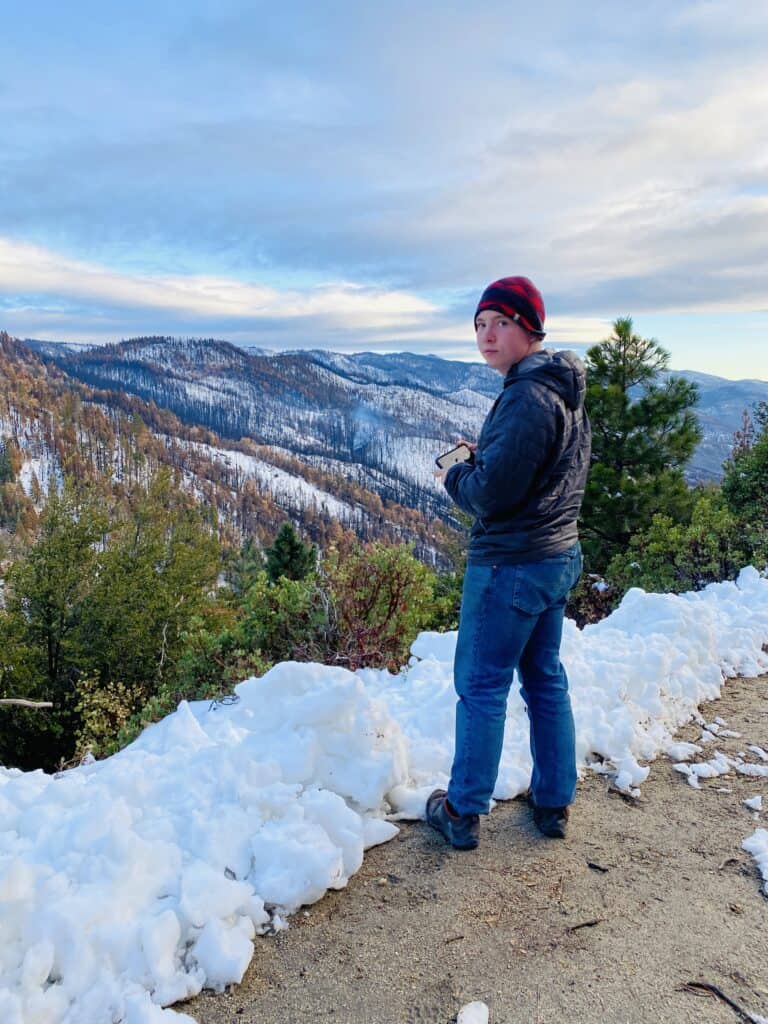 Amanda's son Frederick looking at damage from the Windy Fire, through the Starvation Canyon