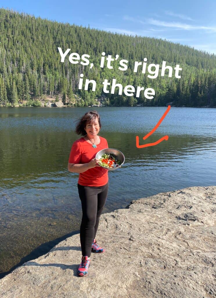 Amanda Rose in the mountains holding a giant salad, with the title "Yes, it's right in there" (and an arrow pointing to the salad.