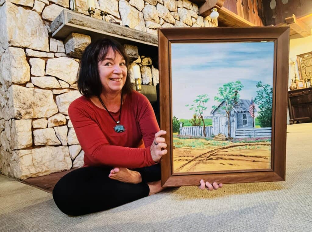 Amanda with the painting of the Arkansas Post Office