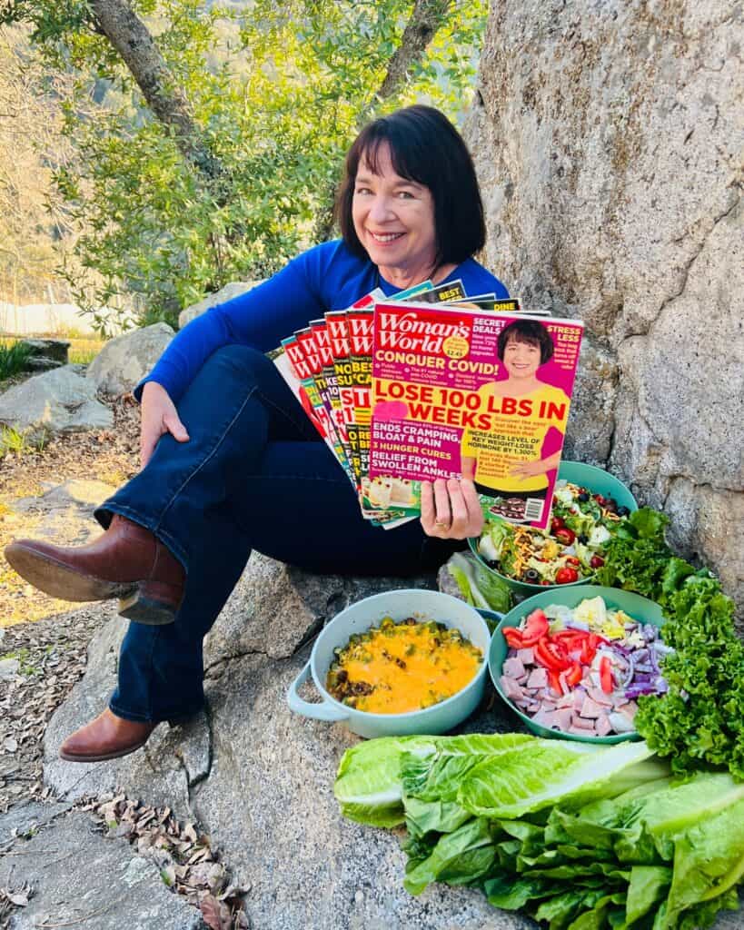 Amanda Rose holding 8 magazines and sitting with Ridiculously Big Salads and Skillets